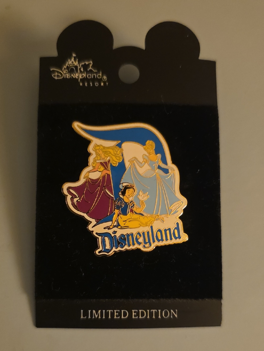 Disneyland Resort limited edition pin featuring Aurora, Cinderella, and Snow Whi